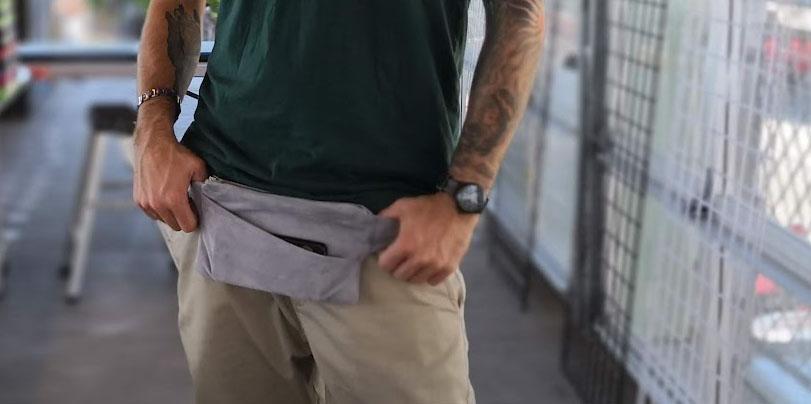 Person wearing gray upcycled suede fanny pack