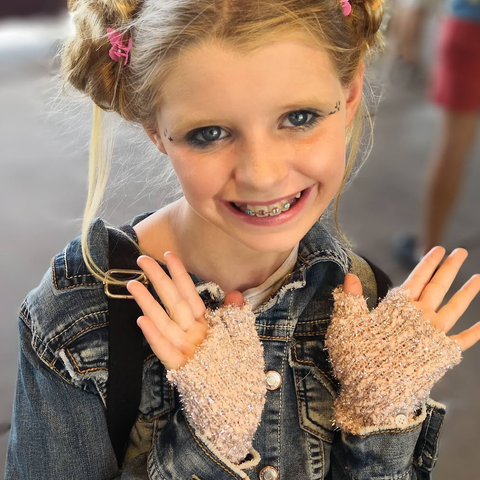 Tween wearing sparkly fingerless Kitten Mittens