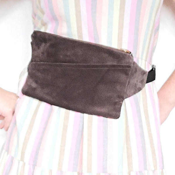 Woman wearing Fringe Vintage dark brown leather fanny pack around her waist