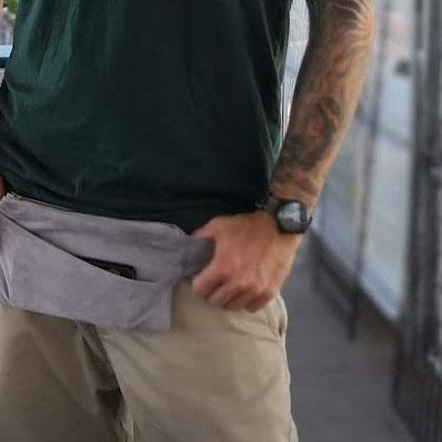 Person wearing gray upcycled suede fanny pack