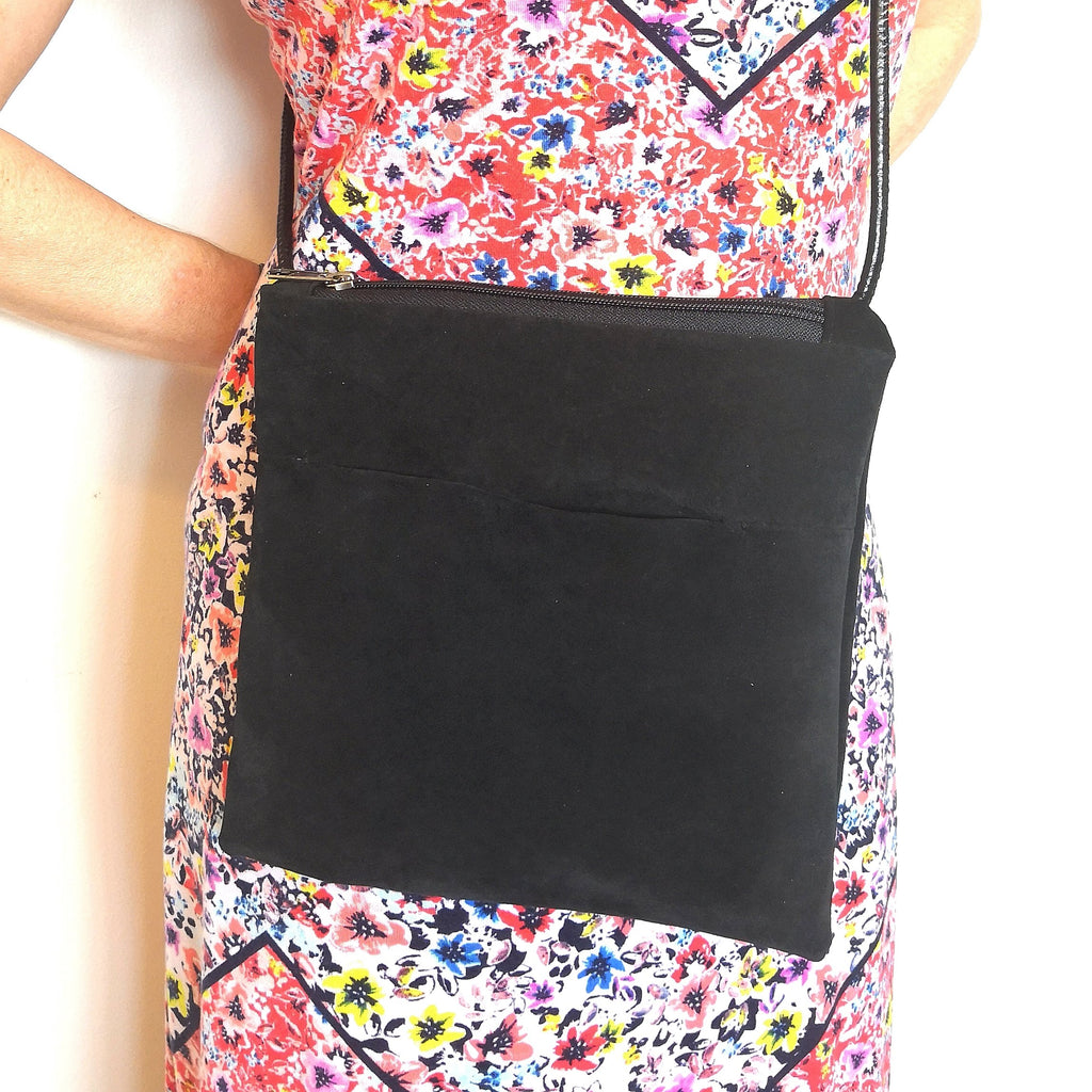 Woman in colorful dress wearing recycled black suede Fringe Vintage bag
