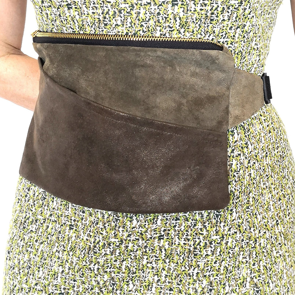 Moss and metallic bronze suede fanny pack around a person's waist