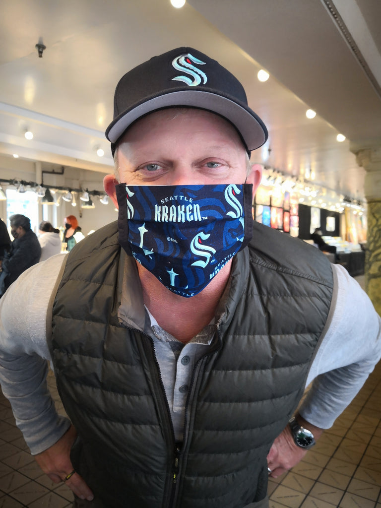 Person wearing Seattle Kraken cotton face mask