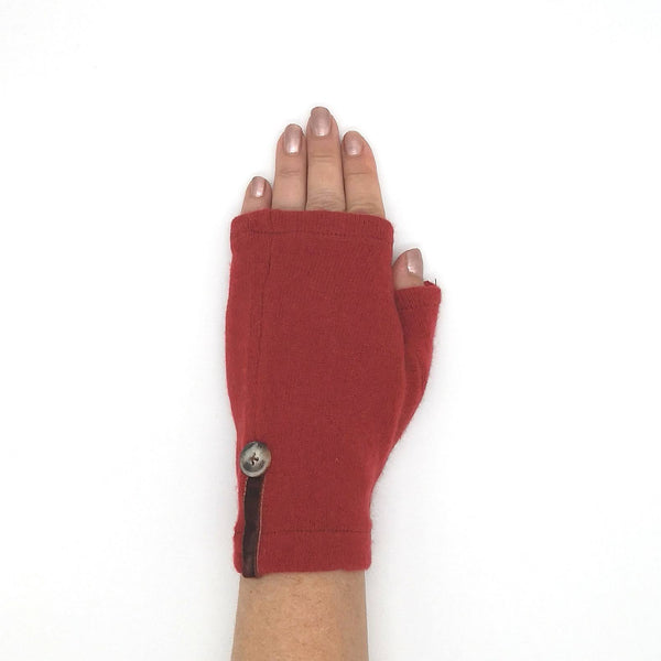 Woman's hand in spice orange cashmere short fingerless mitten
